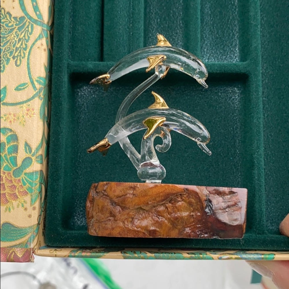 Glass dolphin on wooden base